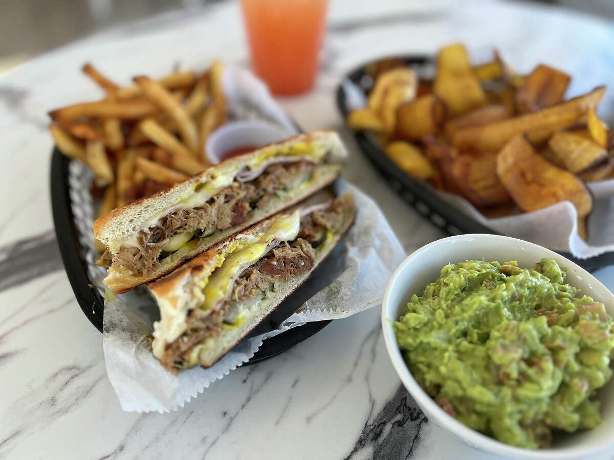 The menu at Bilia Eatery on Northwest Military Highway in San Antonio includes, from left, a Cuban sandwich, guava limeade, plantain chips and guacamole.
