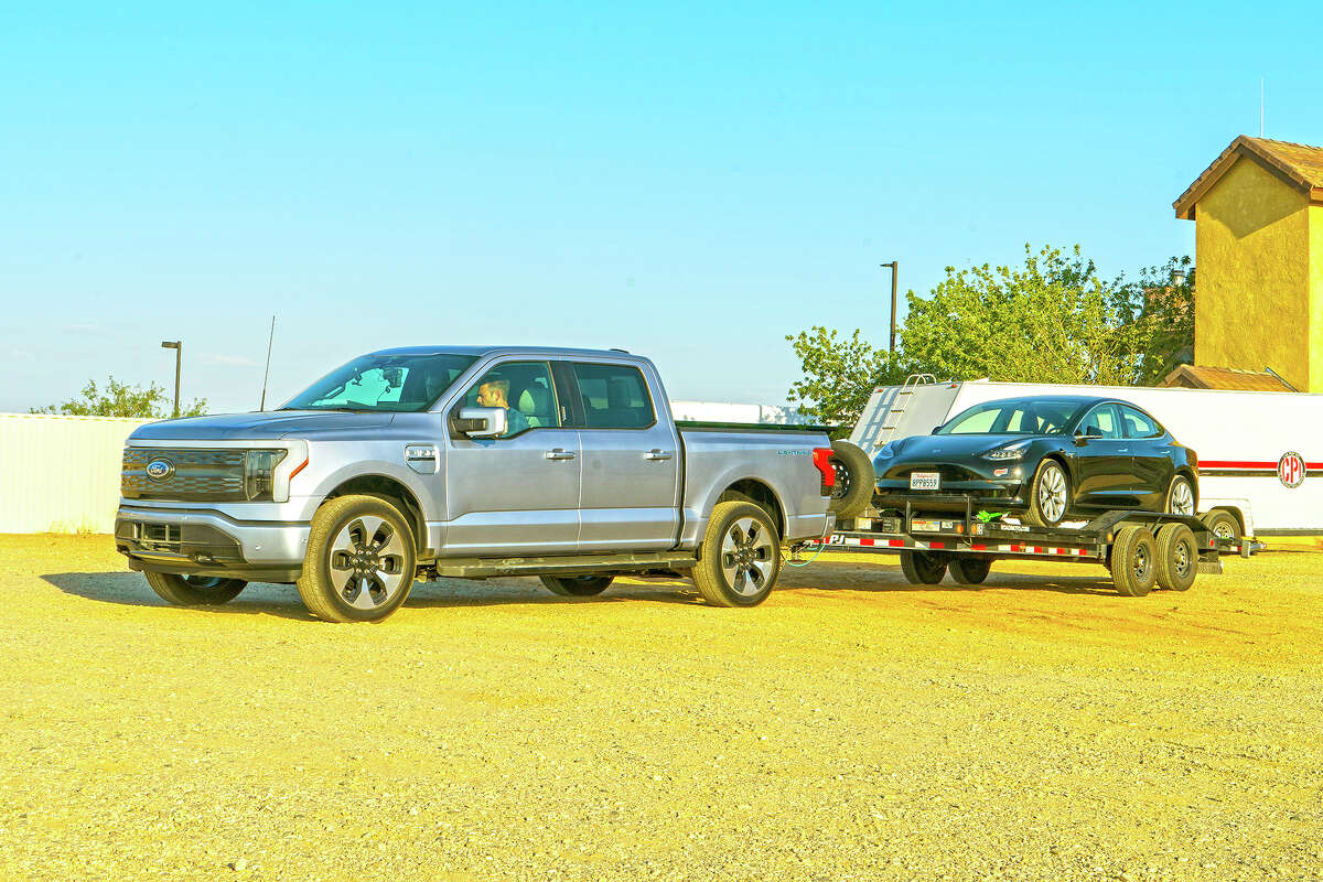 The 2022 Ford Lightning electric pickup truck is capable of towing up to 10,000 pounds, though towing will significantly affect its range.