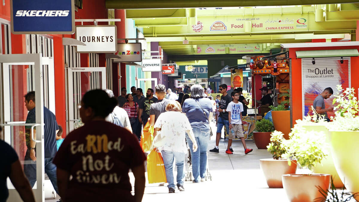 Shoppers browse the Outlet Shoppes at Laredo for deals on Tax Free Weekend on Aug. 11, 2018.