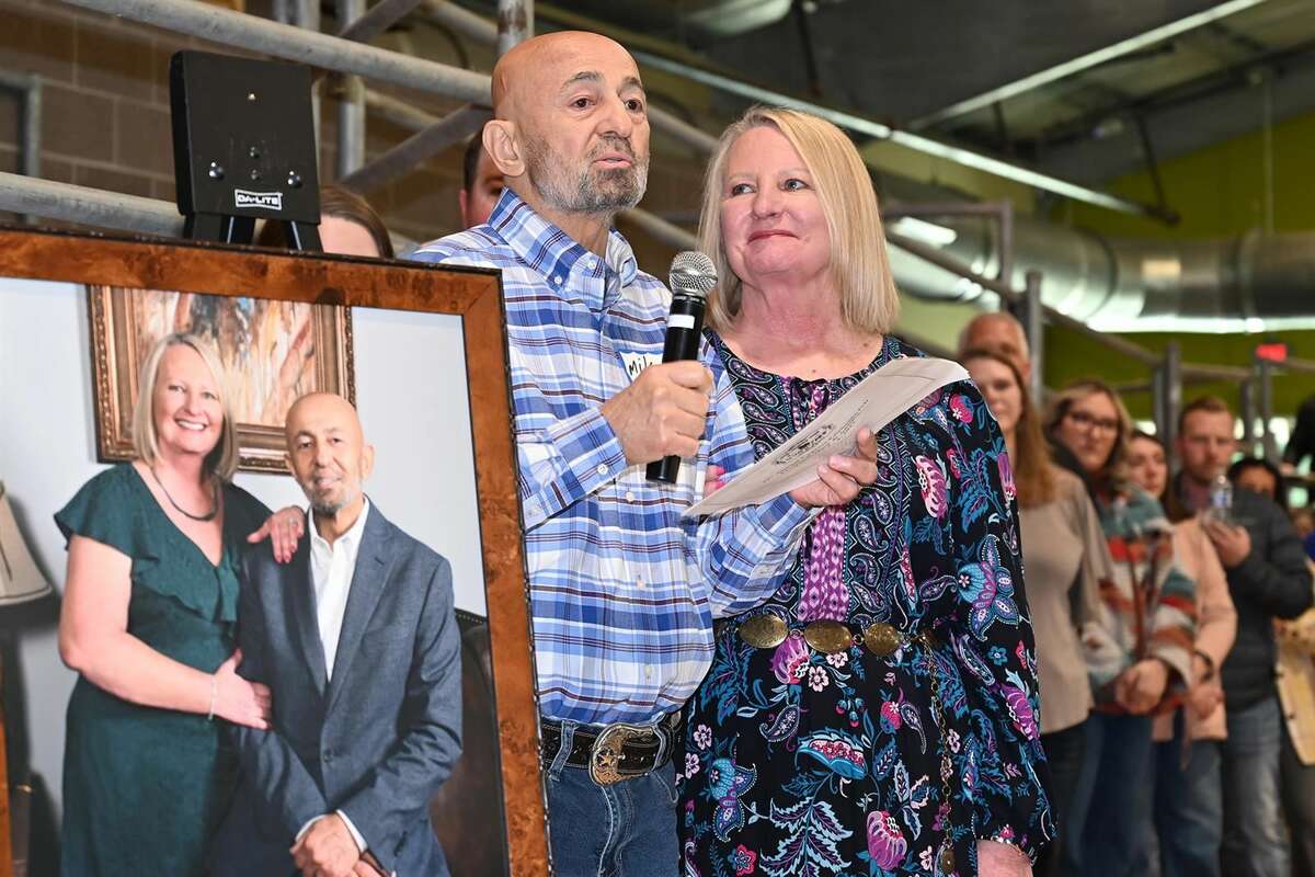 Mike and Darlene Jarrar speak following the unveiling of a portrait before the CFISD Livestock Show Association Show and Sale premium sale. CFISD officially dedicated the Mike & Darlene Jarrar Arena in the CFISD Exhibit Center. Jarrar & Company Inc. was recognized as the event’s volume buyer for the 15th time in the 17 years the award has been presented.