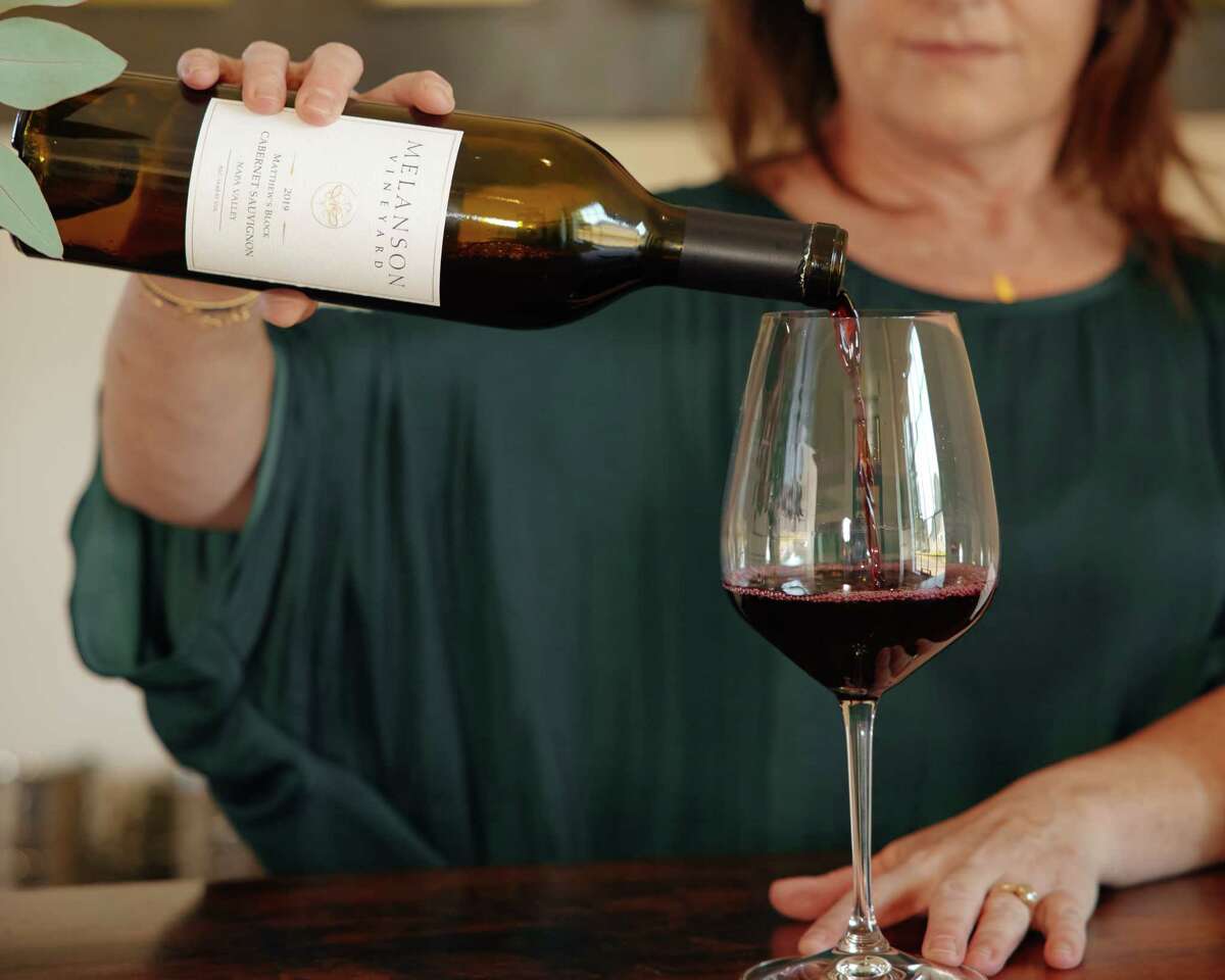 Karen Williams pours wine from Melanson Vineyard, one of Acme's most recent launches. After 20 years, the owners of this prominent vineyard decided to make some wine for their own label and brought it to Acme to sell exclusively.