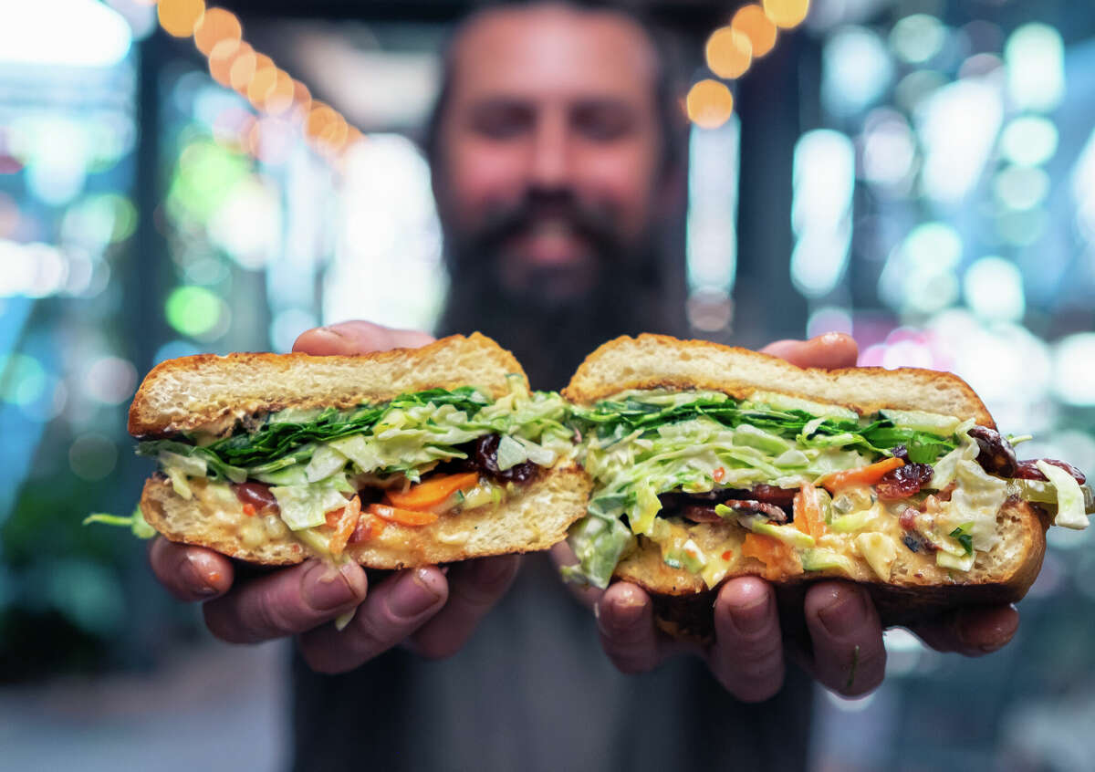Max Swischuk, son of owner Timmy Swischuk, shows off the inner layer of the banh mi sandwich at Timmy’s Brown Bag in Placerville, Calif., on Monday, Feb. 13, 2023. 