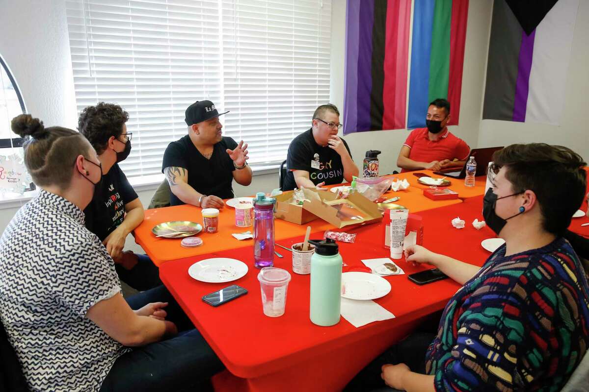 From left, staff members Milo Knight, Rae Messer, Jorge “JC” Chamorro, Julien Frost, Christian Aguirre and Parisa Zamanian chat during a team-building meeting at the Rainbow Community Center, an LGBTQ+ center in Concord. The latest update to the FDA’s guidance for blood donor eligibility essentially does away with blanket bans on men who have sex with men, but still does not allow anyone taking PrEP to prevent HIV infection to donate.