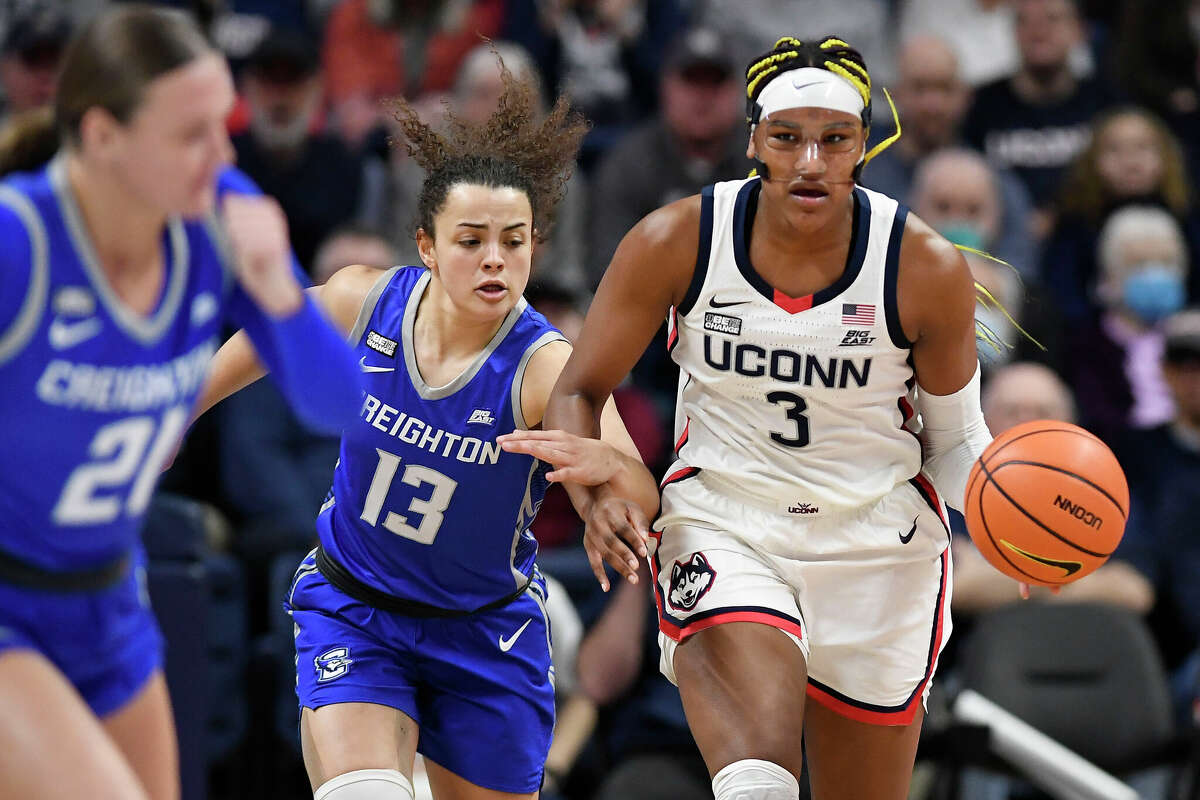 UConn's Aaliyah Edwards (3) steals the ball from Creighton's Rachael Saunders (13) during the first half of an NCAA college basketball game Wednesday, Feb. 15, 2023, in Storrs, Conn. (AP Photo/Jessica Hill)