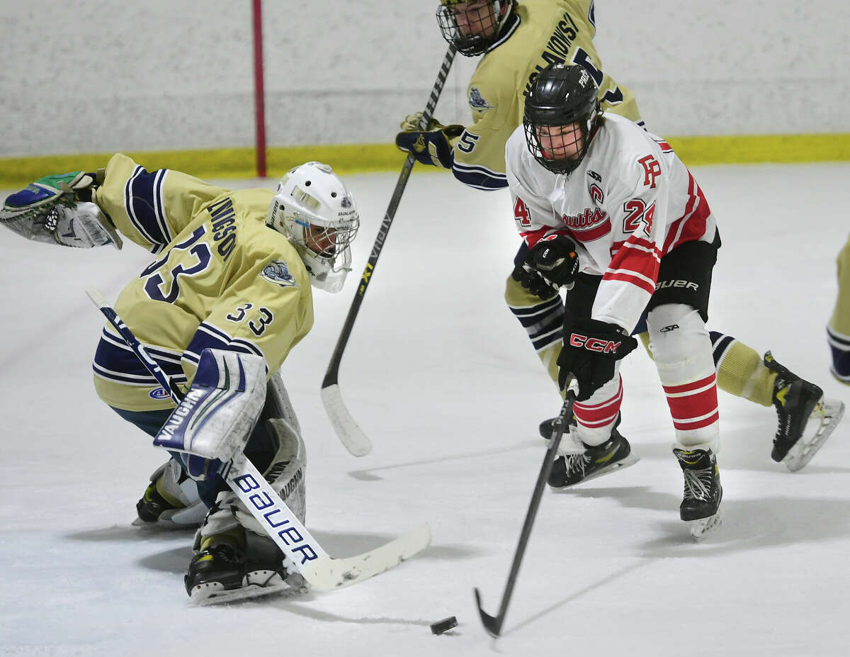 Notre Dame of Fairfield goalie Isaiah Livinston looks to stop the rush of Fairfield Prep's Will Huntington during their hockey game at The Wonderland of Ice in Bridgeport, Conn. on Wednesday, February 15, 2023.
