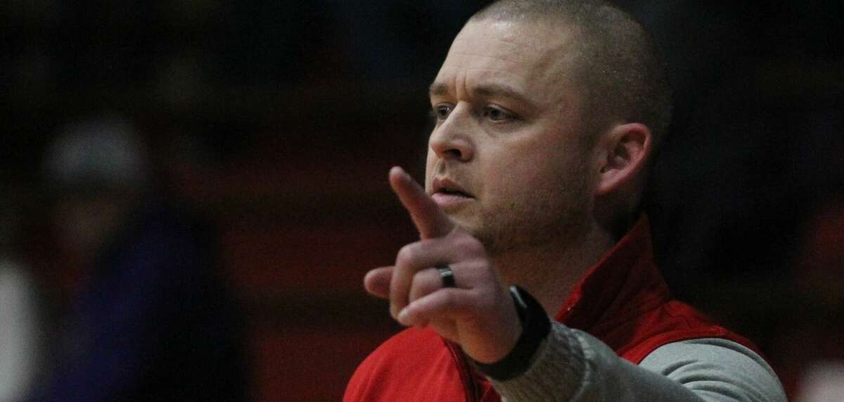 Cory Bunner coaches the Jacksonville varsity boys' basketball team Wednesday night at The JHS Bowl.