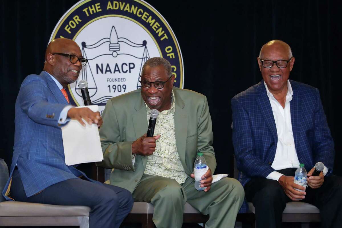 Houston Astros manager Dusty Baker, center, laughs along with moderator Bishop James Dixon, left, and former Astros player Enos Cabell, right, as they all tell stories about Baker through the years during a NAACP ceremony to honor Baker, held in Diamond Club at Minute Maid Park Wednesday, Feb. 15, 2023 in Houston, TX.