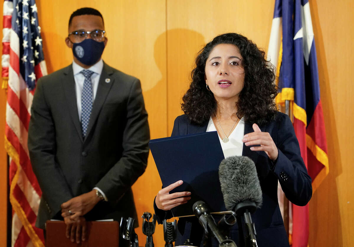 Harris County Attorney Christian Menefee, left, and Harris County Judge Lina Hidalgo, right, are shown during a press conference Wednesday, June 23, 2021 in Houston.
