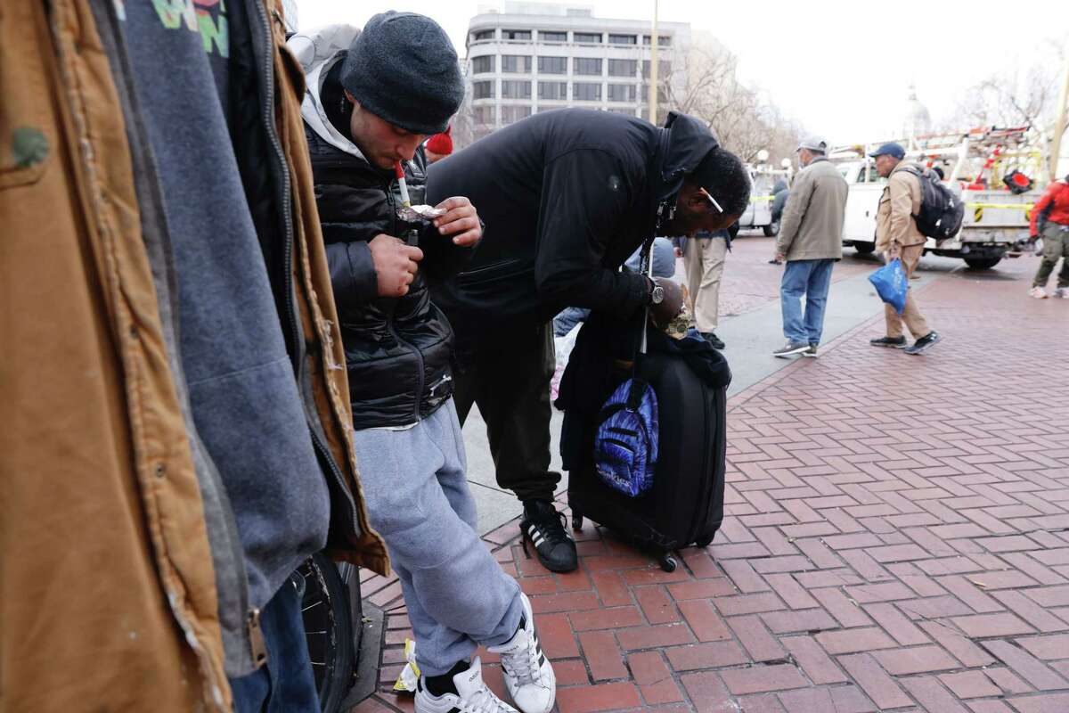 Mike smokes fentanyl at Civic Center Plaza in San Francisco.