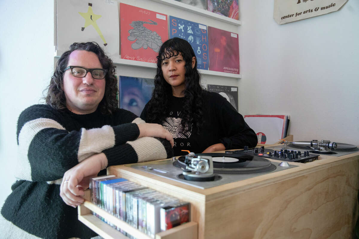 Left to right, Matt Brownell and Cat Lauigan are co-owners of Cone Shape Top record store in Oakland, Calif., on Feb. 14, 2023.
