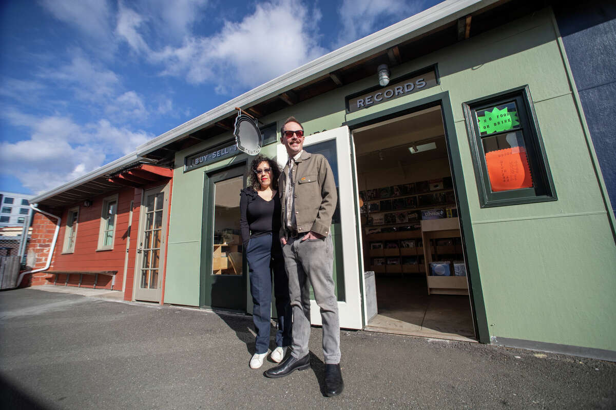 (Left to right) Hannah Lew and Andrew Kerwin co-own Contact Records which recently opened a new location in Temescal Alley in Oakland, Calif. on Feb. 14, 2023.