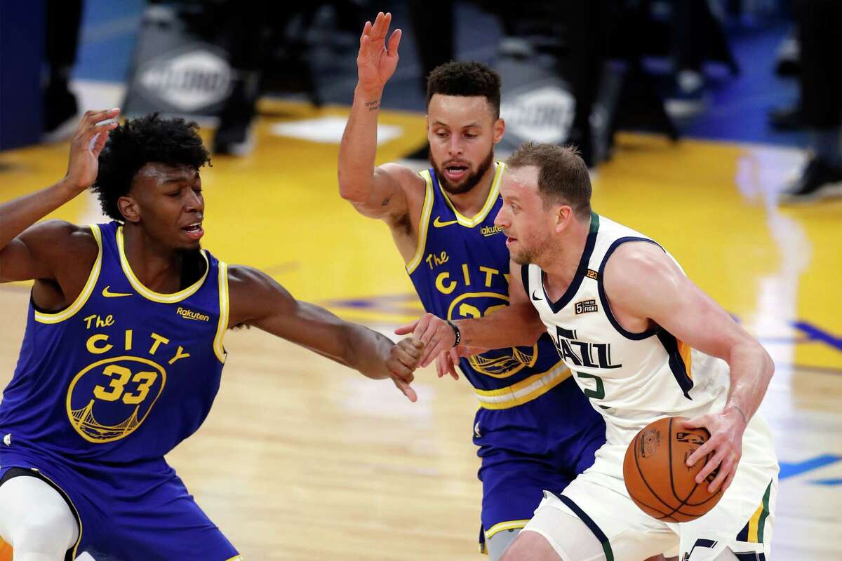Golden State Warriors' James Wiseman and Stephen Curry guard Utah Jazz' Joe Ingles in 1st quarter during NBA game at Chase Center in San Francisco, Calif., on Sunday, March 14, 2021.