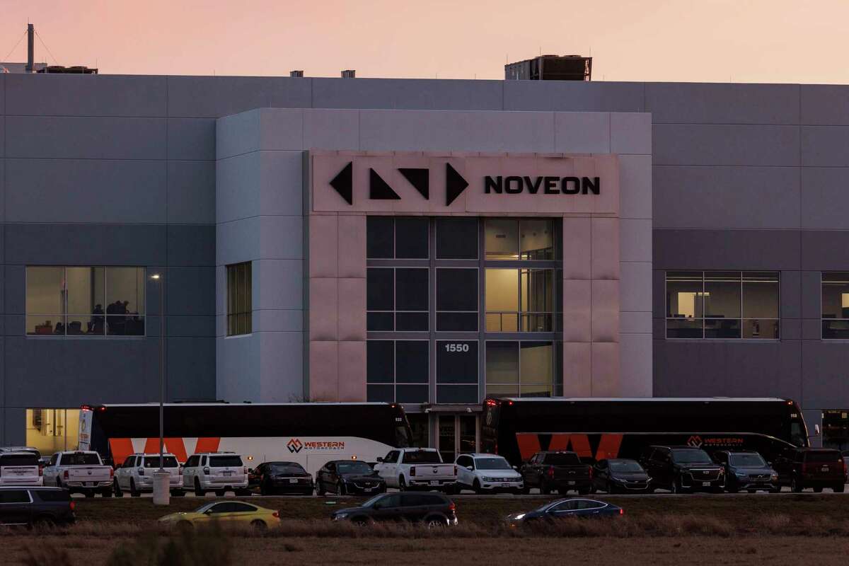 Charter buses drop people off in front of Noveon Magnetics, a rare earth magnet manufacturing facility in San Marcos, Thursday night, Feb. 16, 2023, where Gov. Greg Abbott gave his State of the State address. The televised speech was not open to the general public or members of the media.