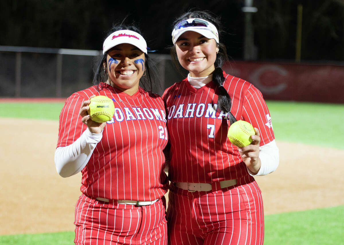 Coahoma’s Avery Rodriguez, left, and Mia Clemmer, hold up their home run game balls. Clemmer hit a grand slam and Rodriguez followed right after by going deep in the second inning of their season opener against Monahans on Feb. 16. 