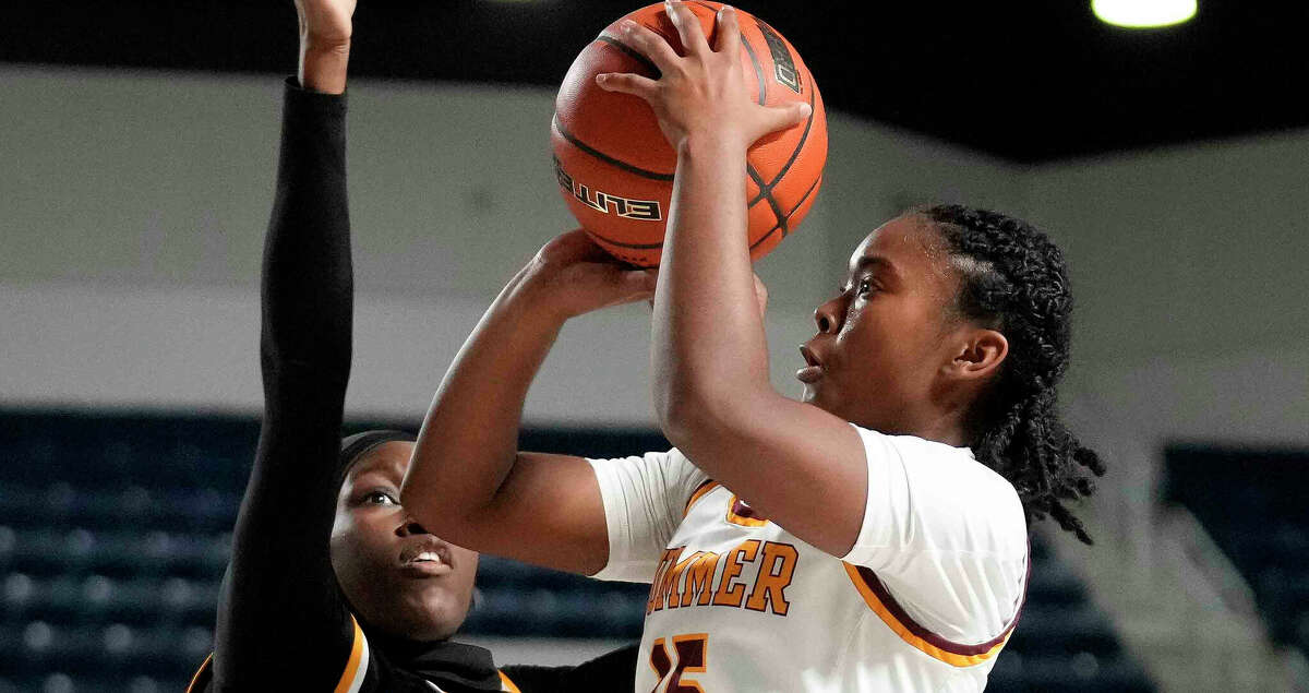 Summer Creek guard Janiya Murphy, right, shoots as Hastings guard Ameenat Adisa defends during the first half of a Region III-6A area high school basketball playoff game, Thursday, Feb. 16, 2023, in Houston.