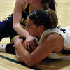 Father McGivney's Alexis Bond fights for a loose ball against Carlyle in the Class 1A Metro-East Lutheran Regional championship game on Thursday in Edwardsville.