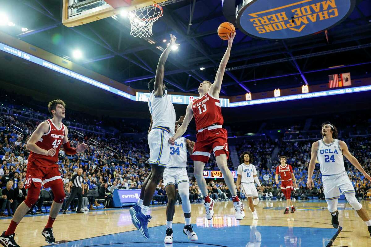 Stanford guard Michael Jones (13) shoots against UCLA forward Adem Bona during the first half of an NCAA college basketball game Thursday, Feb. 16, 2023, in Los Angeles. (AP Photo/Ringo H.W. Chiu)