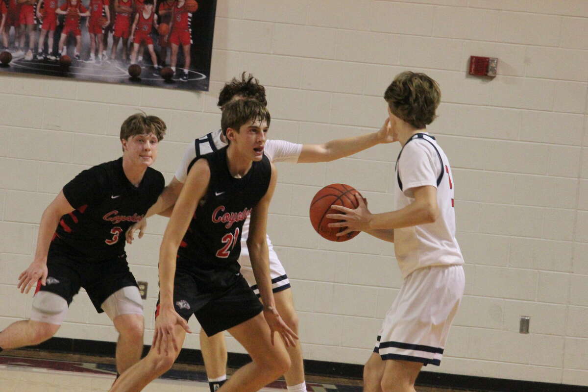 Reed City's Max Hammond (3) and Ty Kailing (21) focus on defense during a game against Big Rapids earlier this month.