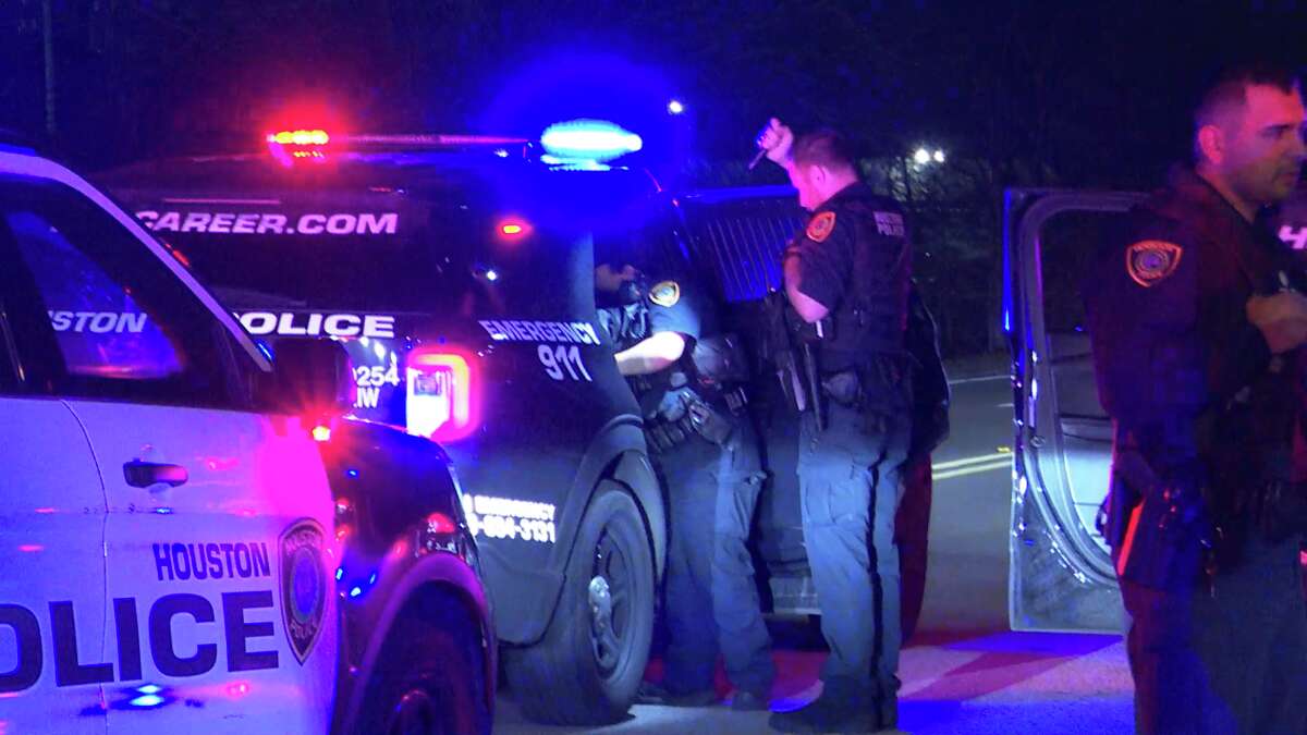 Police respond after a police chase through west Houston ended with an officer striking a bystander SUV with his patrol vehicle.