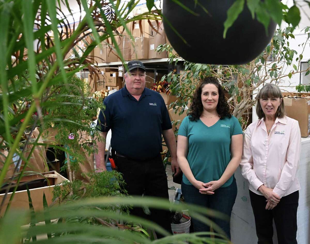 Capital InteriorScapes co-owners Gregg, left, and Karen McGowan, right, with Gina Butera, center, on Thursday, Feb. 16, 2023, at the Capital InteriorScapes warehouse in Ballston Spa, N.Y.