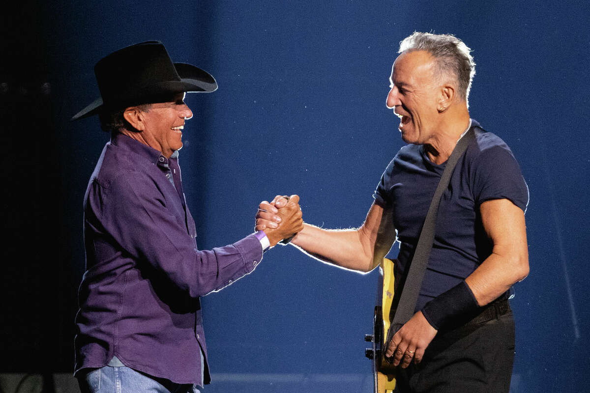 George Strait (L) introduces Bruce Springsteen during the Bruce Springsteen and The E Street Band 2023 tour at the Moody Center on February 16, 2023 in Austin, Texas. 