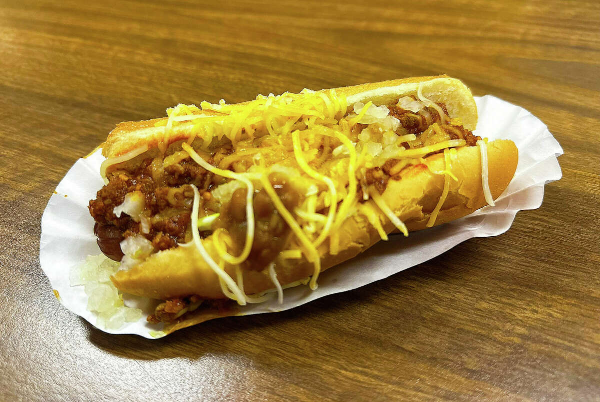 The Huron Daily Tribune's "Breaking Bread with Birdsie" writer gets his chili dog on with The Coney Guys. Above, one of The Coney Guys' signature dogs with chili sauce, cheese and onions.