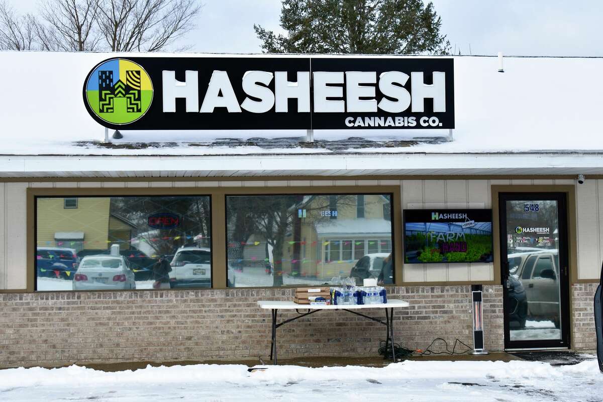Hasheesh Cannabis staff serve new customers visiting for the opening day of the new provisioning center in Big Rapids on Friday, Feb. 17. 