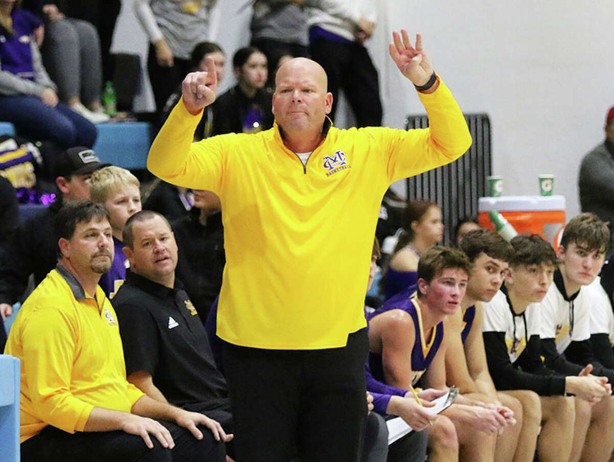 CM coach Lee Green signals in a play during his Eagles' MVC game earlier this season at Jerseyville. The Eagles have been awarded a forfeit victory over Cahokia in the scheduled quarterfinal game Saturday at the CM Class 3A Regional. The Eagles advance to Wednesday's semifinals in Bethalto.