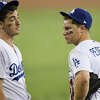 Cody Bellinger #35 and Joc Pederson #31 of the Los Angeles Dodgers react after their team allowed a thirteenth inning run to the Boston Red Sox in Game Three of the 2018 World Series at Dodger Stadium on October 26, 2018 in Los Angeles, California.