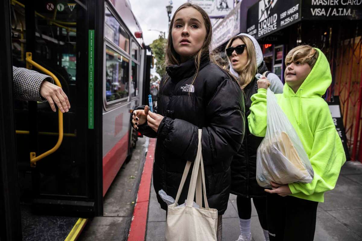 Yana, 13, looks for a bus in San Francisco. The eighth-grader has been subject to bullying in school after fleeing Ukraine with her mother.