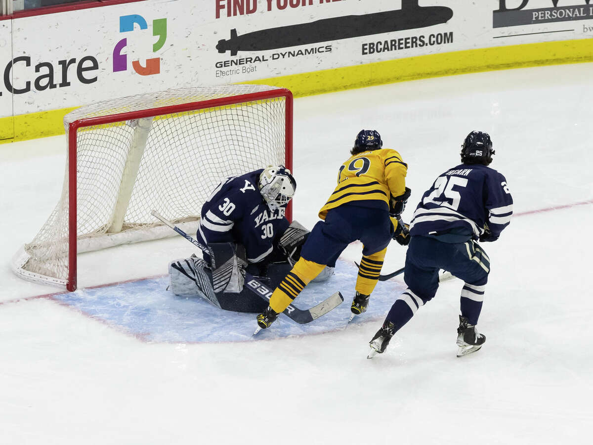 Yale goaltender Luke Pearson #30 stops Quinnipiac right Wing Cristophe Tellier from in close during first period action on Friday Feb. 17 2023. 