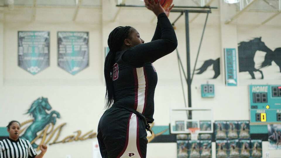 Pearland's La'Niah Thornton (30) puts up a shot against North Shore in the 6A area basketball playoffs Friday, Feb. 17, 2023 at Pasadena Memorial High School.