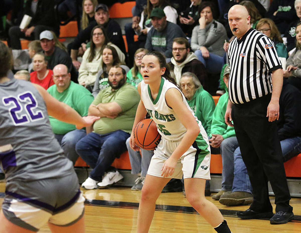 Carrollton's Sophie Pohlman looks over her options with the ball in the first half against Jacksonville Routt on Friday night in the title game of the Greenfield Class 1A Regional.