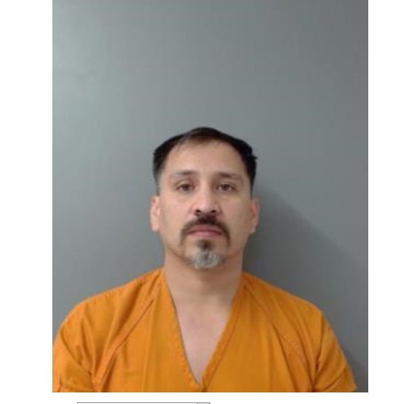 Laredo police said a man had 15 firerams, ammo and more than $24,000.