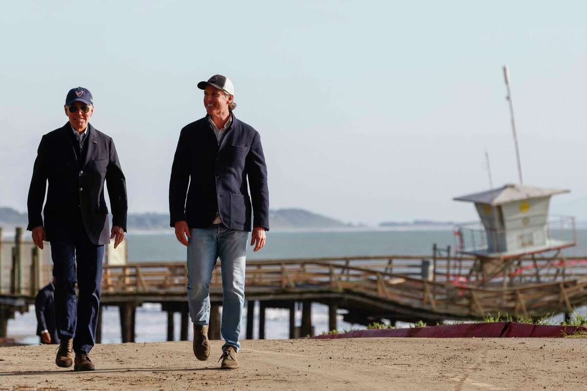 President Joe Biden is joined by California Governor Gavin Newsom as he tours the damage done to Seacliff Pier and Seacliff State Beach in Aptos on Jan. 19, 2023 while on a tour to assess damage caused by a series of major storms.