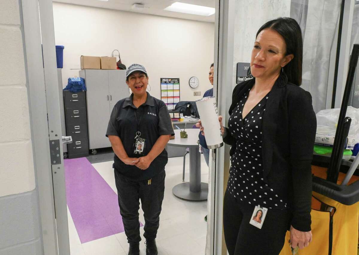 Rogers Middle School Principal Julie May, right, greets head custodian Maria Lerma on Feb. 7. May asked her to never leave for other opportunities because of her value to the school, which is converting to an all-honors model focused on college readiness. Public school districts have embraced the reality that parents can choose their kids’ schools and are refining and expanding the available options.