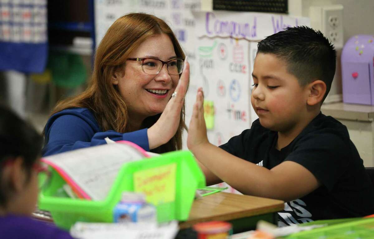 Principal Rebecca De Leon encourages a young student Feb. 8 at Graebner Elementary, which is forming a partnership with UTSA. SAISD has the most partnerships aimed at attracting and retaining students and turning around struggling schools, but this fall a few programs fell below standard and were terminated.