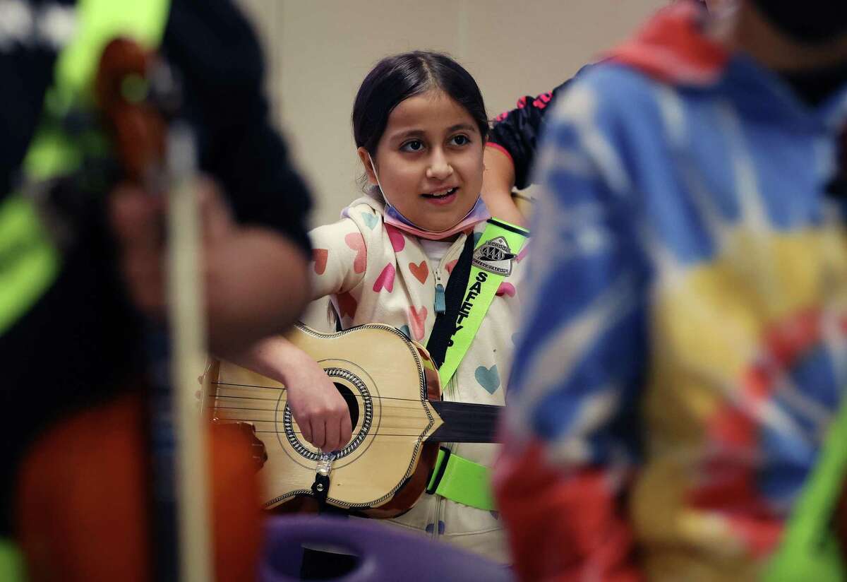 A student plays the guitar in ariachi class Feb. 8 at Graebner Elementary, which is forming a partnership with UTSA to improve its dual language program. SAISD has the most partnerships aimed at attracting and retaining students and turning around struggling schools, but this fall a few programs fell below standard and were terminated.