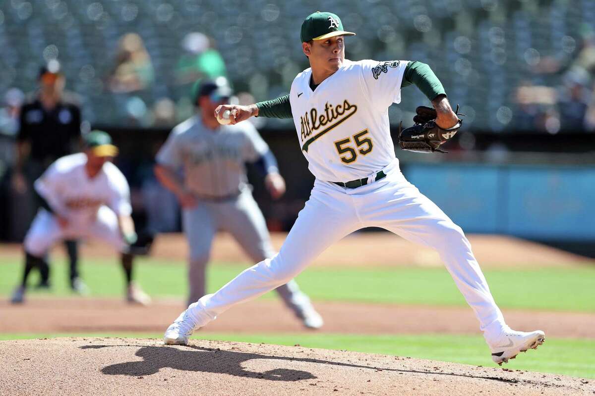 Oakland Athletics’ Adrian Martinez pitches in 1st inning against Seattle Mariners during MLB game at Oakland Coliseum in Oakland, Calif., on Thursday, September 22, 2022.