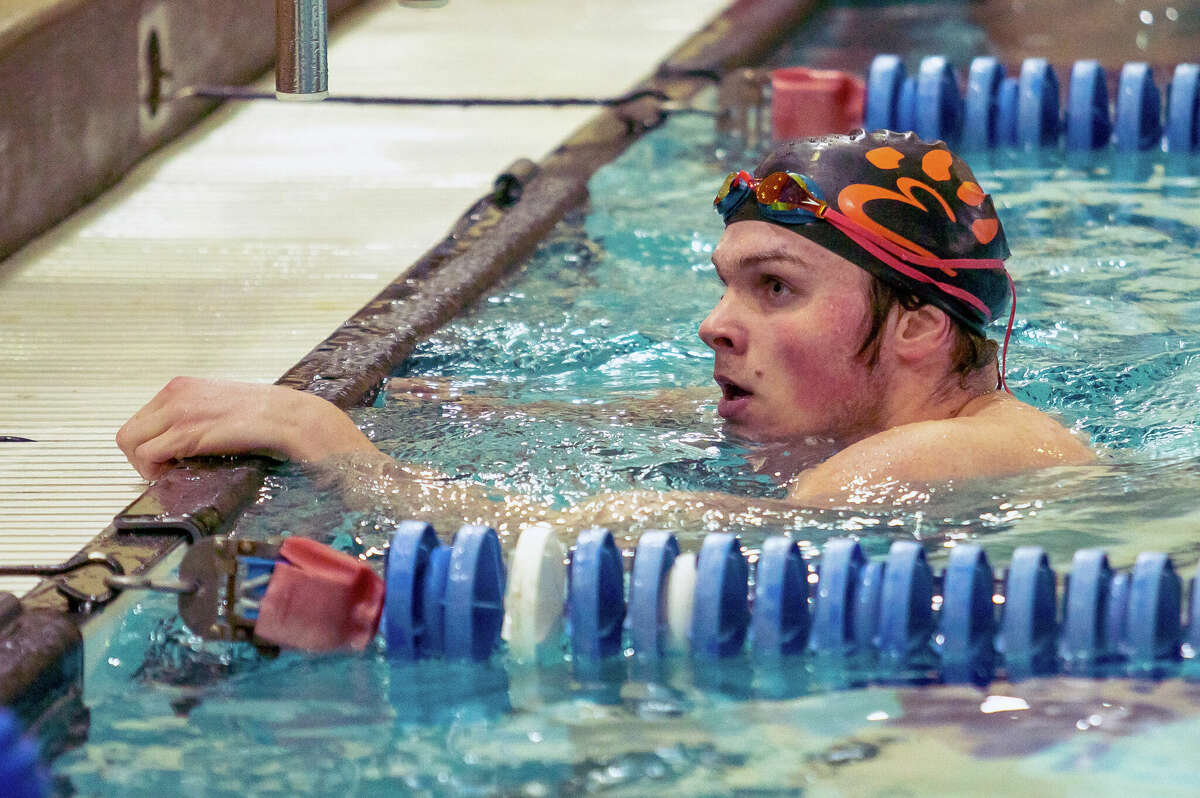 Edwardsville's Cohen Osborn recovers at the end of the 100-yard butterfly. at Saturday's IHSA Boys Sectional Swim Meet in Edwardsville.