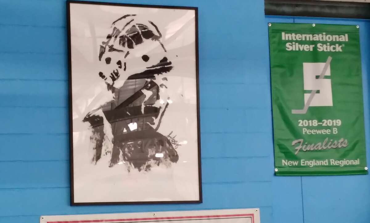 A painting of Charlie Capalbo was unveiled at the Wonderland of Ice as the Fairfield co-op boys hockey team honored its former goalie before a game vs. Greenwich on Saturday. 