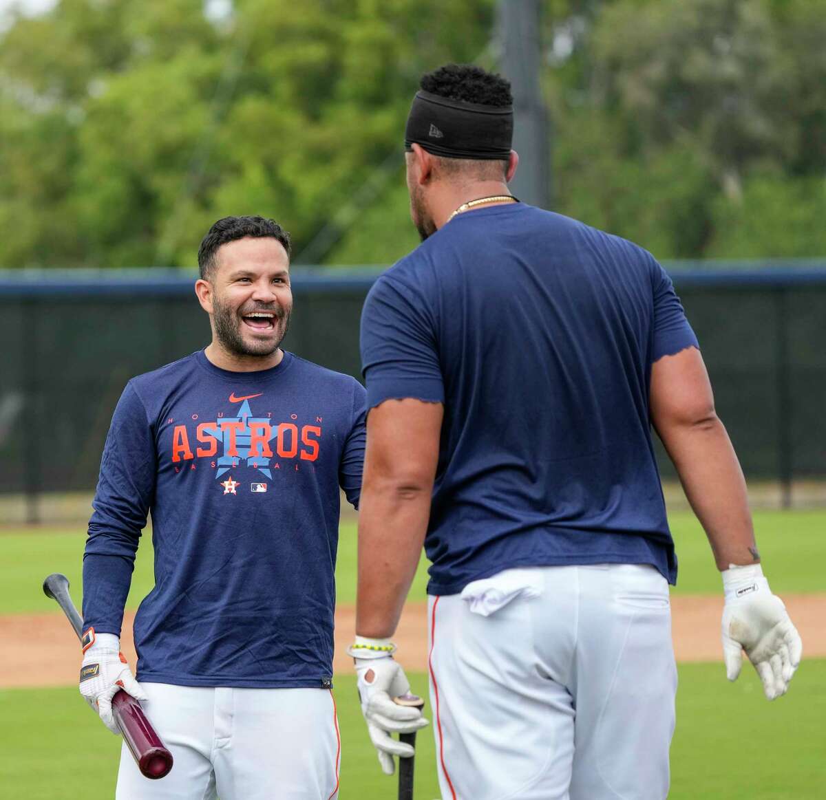 Houston Astros second baseman Jose Altuve laughs with first baseman Jose Abreu during workouts at the Astros spring training complex at The Ballpark of the Palm Beaches on Sunday, Feb. 19, 2023 in West Palm Beach .