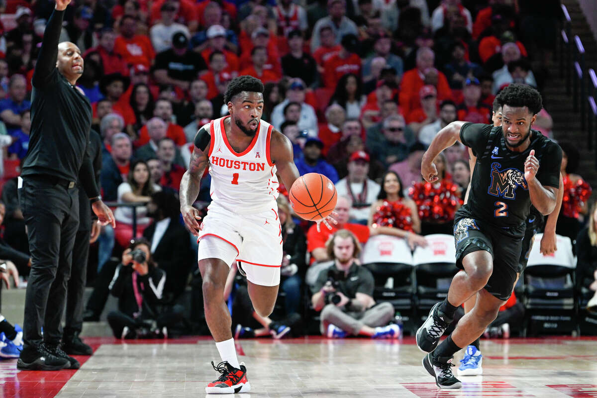 Houston Cougars guard Jamal Shead (1) leads a fast break during the basketball game between the Memphis Tigers and Houston Cougars at the Fertitta Center on February 19, 2023 in Houston.