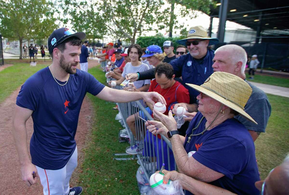 Houston Astros outfielder Chas McCormick signs autographs for fan, Donna Hopkins, during workouts at the Astros spring training complex at The Ballpark of the Palm Beaches on Monday, Feb. 20, 2023 in West Palm Beach .