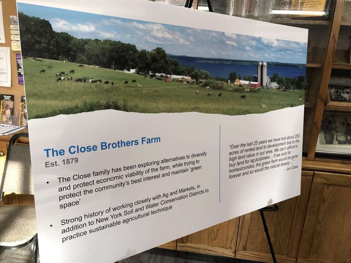 A poster board during an open house on a 40-megawatt solar project shows the Close Brothers Farm in Mayfield.