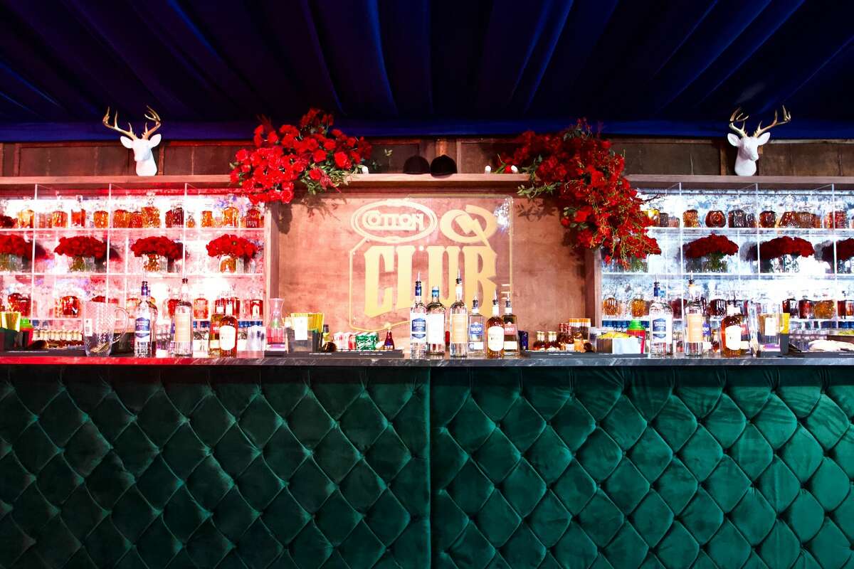 Cotton 'Q Club's 50-foot bar with emerald tufting showcased a popular crystal whiskey wall.