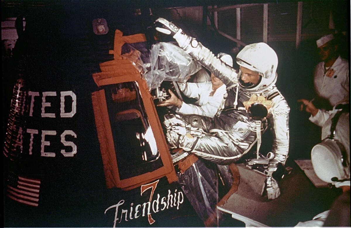 Astronaut John Glenn, Jr. is loaded into the Friendship 7 capsule in preparation for flight on the Mercury Titan rocket February 20, 1962.
