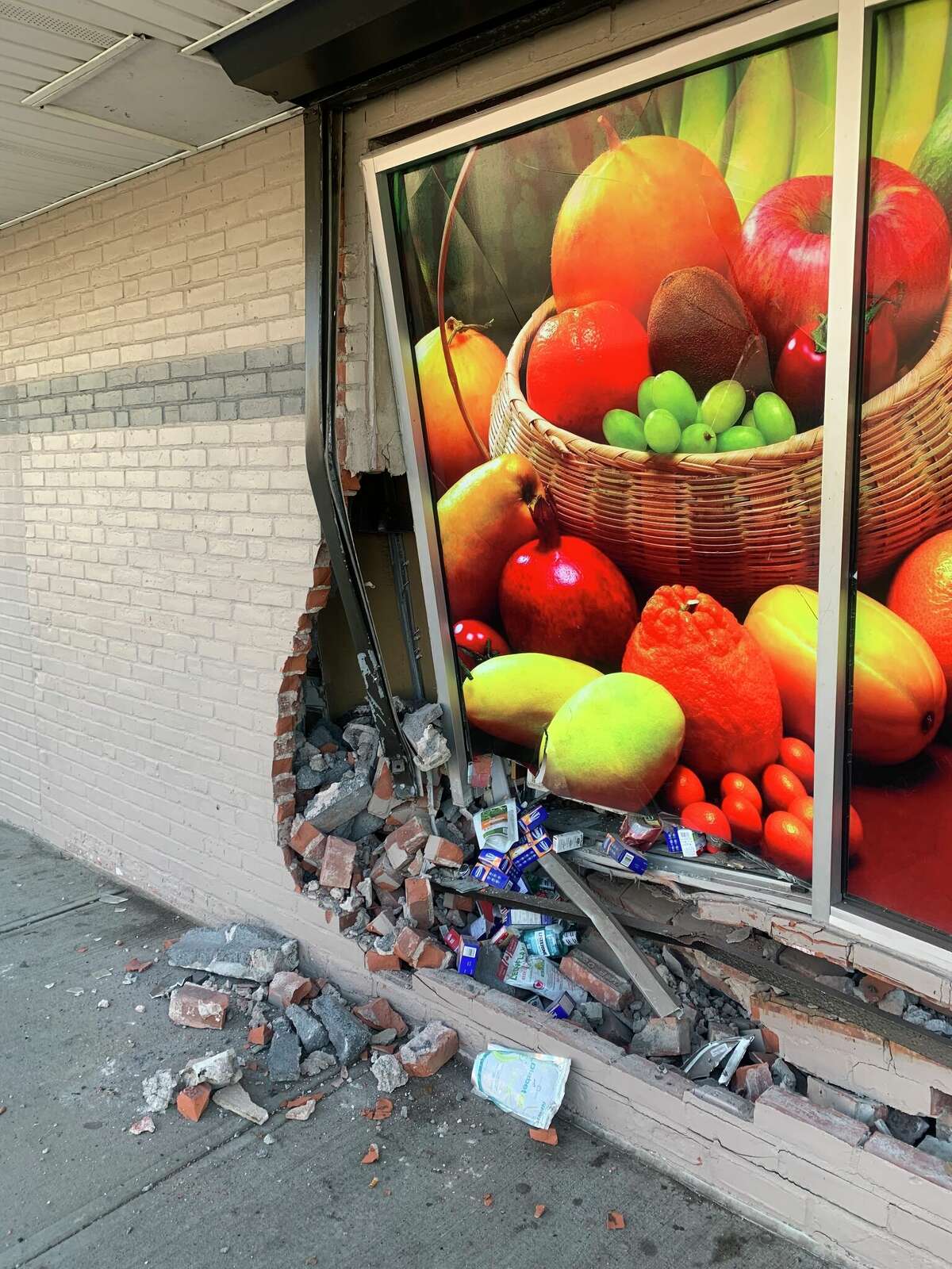 A vehicle rammed into a CTown Supermarket on Greenwich Avenue Monday, injuring the driver, a store employee and a customer, New Haven authorities said. 
