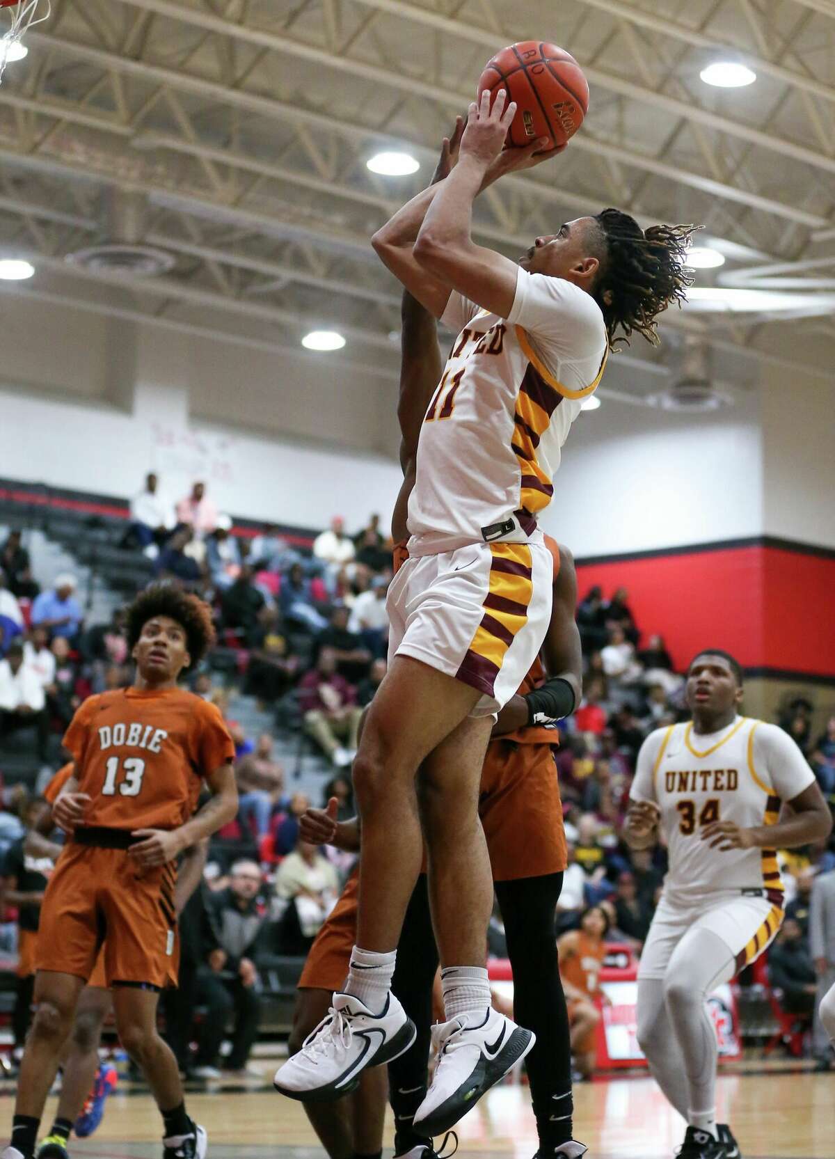 Beaumont United guard Kayde Dotson attempts a shot during a first-round game against Dobie at Port Arthur Memorial High School. 