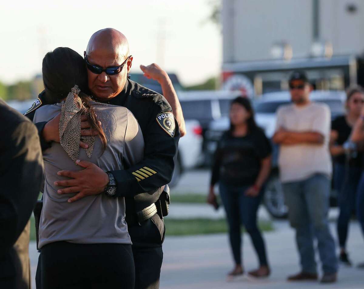 Former Uvalde CISD Police Chief Pete Arredondo hugs a woman after the vigil held in remembrance of the 21 people, including 19 children, who were killed at the Robb Elementary School mass shooting, Wednesday, May 25, 2022, at the Uvalde County Fairplex in Uvalde, Texas.